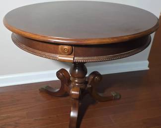 Traditional Round Mahogany Drum Table With Pedestal Base And Distinct Brass Lion Paw Feet