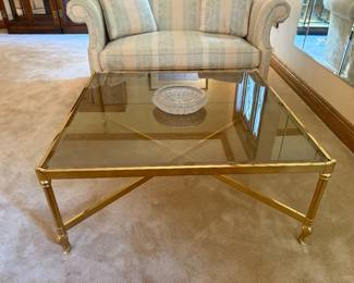 HOLLYWOOD REGENCY STYLE HEAVY BRASS COFFEE TABLE WITH SMOKED GLASS