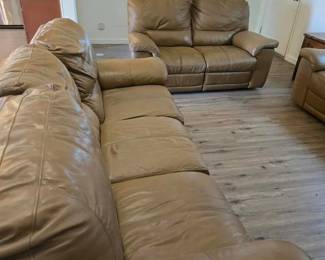 2 leather reclining couches and a loveseat