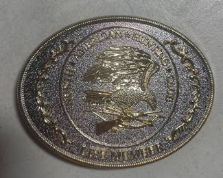 A belt buckle honoring a 'Life Member' in the North American  Hunting Club.