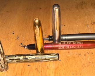 Top and bottom are Wearevers and the 1 in the middle is  R L Arnold fountain Pen. This pen reads "Brilliant Bronze Save on Gasolene" This pen was promted by Johnson OilCo. out of Janesville circa 1930s...  when the common spelling of gasoline was 'gasolene'.