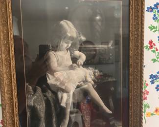 Girl on a chair and framed. 