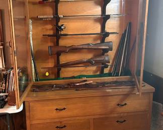 Gun/Fish rod display cabinet on top with drawers as the base. Gunbarrels gun stock gun straps are included in the pitcher.