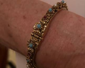 A Florenza 30 rhinestone hinged bangle bracelet.