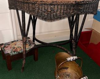 A wicker table w/ a wood top.