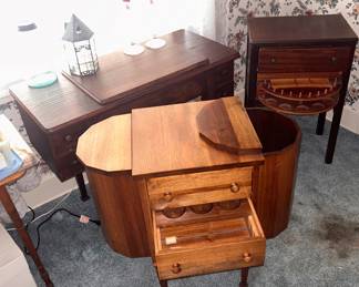 1 of 2 Martha Washington sewing cabinets and a pivoting spool rack sewing cabinet . The sewing machine cabinet is empty.