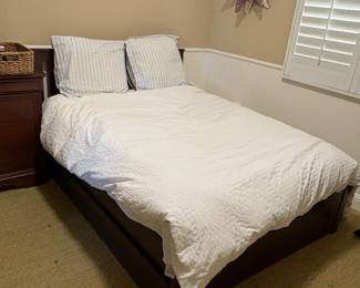 $100 - queen bed with storage drawers under (includes mattress and bedding) 