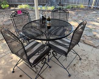 Very nice like new wrought iron patio set with rocker chairs!