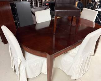 Dining room table with skirted Parsonschairs