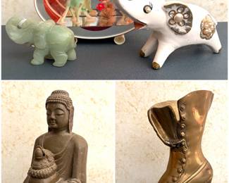 a vintage decorative convex glass display dome, two elephant figurines including a jade like figurine and a ceramic white one with gold accents. A vintage seated Buddha figurine and a vintage brass boot