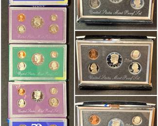 A collection of vintage U.S. Mint Proof Sets in their original packaging