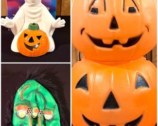A vintage ceramic Halloween figurine,  a vintage green rubber Halloween mask and a stack of two orange plastic blow-mold Halloween jack-o'-lantern buckets.