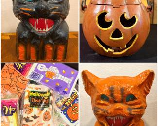 A vintage paper-mache Halloween cat lantern,   a cast iron jack-o'-lantern candle holder, a lot of vintage-style paper Halloween trick-or-treat candy bags. And an vintage orange paper-mache cat lantern.