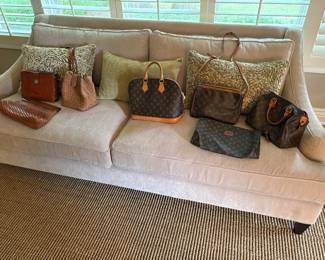 Louis Vuitton, Vecchi, GEN and Italian purses and another view of the ivory 2-cushion couch