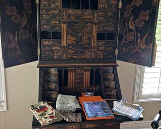 Black and gold Chinoiserie secretary desk - reproduction piece by Horchow shown with Hermes and Burberry scarves