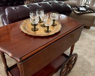 Vintage bar cart with gold leaf tray and vintage wine glasses