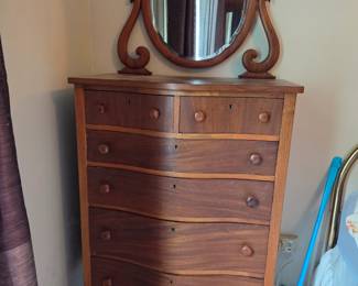 Early American tall boy dresser with mirror