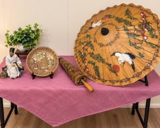 Chinese umbrellas, plate and statue