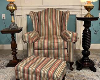 Upholstered chair and ottoman, two pedestal stands, two parlor lamps