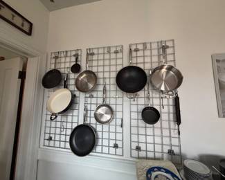 Pans for sale, wall unit holding pans is not