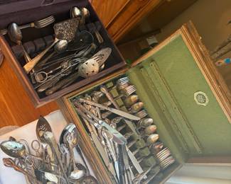 Vintage silverware set with wooden storage boxes