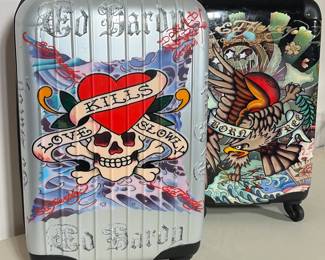 PAIR OF ED HARDY BY CHRISTIAN AUDIGIER ROLLING HARDSHELL SUITCASES