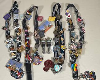 COLLECTION OF DISNEY ENAMEL PINS, LANYARDS, AND BOTTLE STOPPERS