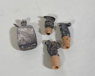 (4pc) STERLING SILVER NEOCLASSICAL STYLE FLASK AND THREE SILVER PLATED BOTTLE STOPPERS