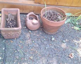 Assorted Terracotta Garden Planters: Oak Leaf Relief Rectangular Planter, Bird-Shaped Vessel, and Chipped Circular Pot