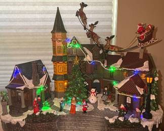 Animated Christmas Village Scene with Santa Sleigh
