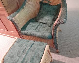 Wicker chair with wicker ottoman.  
