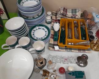 Dishes with matching flatware and linens