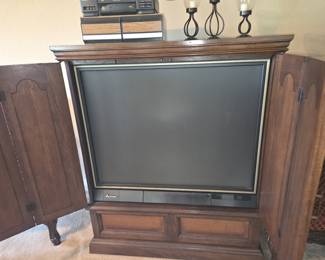 Wood cabinet with built in television.