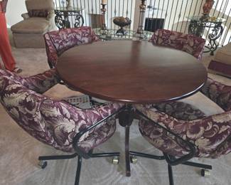 Vintage Dining Table Set with 4 Upholstered chairs on wheels.