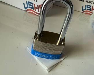 12 heavy duty combination padlocks plus 10 gold doorknobs with keys.