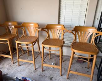4 wooden high bar stools.