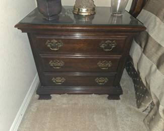 Dark wood with glass topper night stand.