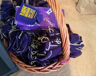 Basket full of Crown Royal bags great for crafts many uses.