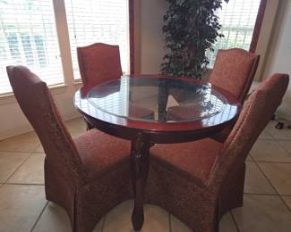 Kitchen 48 inch wood& glass dining table with 4 Upholstered high back chairs.
