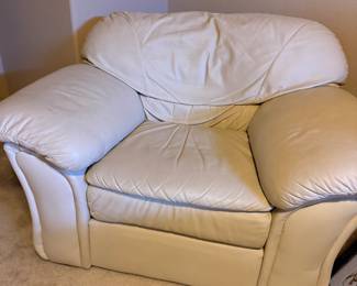 Oversize white leather chair with ottoman.
