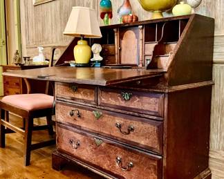 Slant front desk. Drop lid with pigeonhole interior, drawers below.