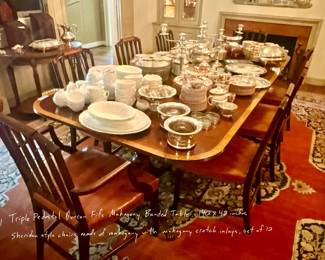 Triple Pedestal Duncan Phyfe Mahogany Banded 140 inch table and set of 12 Sheridan style chairs with crotch mahogany inlays.