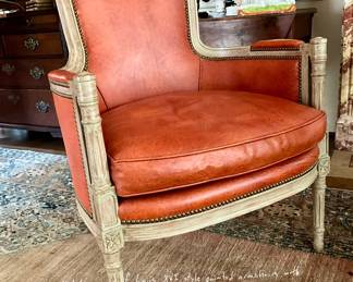 Louis XVI style painted armchair with cognac leather and nailhead trim. Tall back, fluted legs, and gingham outside back