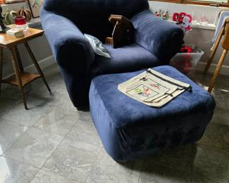 This is the leather chair with a slip cover on it