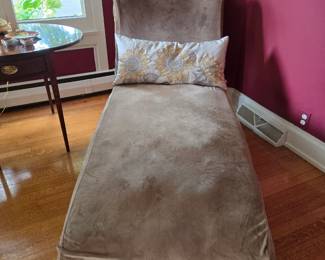 Chaise has a tan slip cover