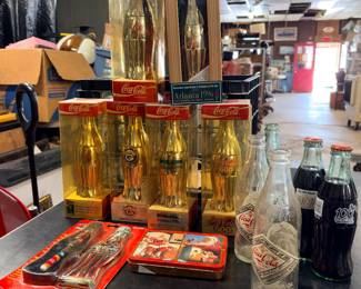 Collection of commemorative Coca-Cola bottles from the 1990s