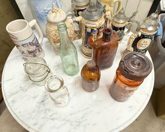 Collection of antique bottles and Steins