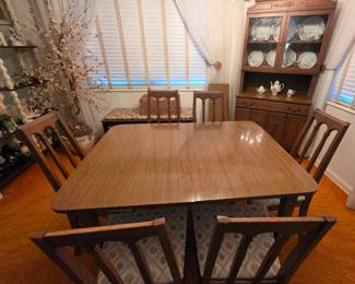 Vintage Drexel "Disign for Living" dining suite that includes this extension table with 1 leaf, 6 chairs and 2-pc china cabinet. Cloth seats are in great condition.