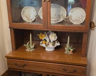 Drexel china cabinet from previous picture; contents sold separately. Noritake China #5142 Lasalle, this set has complete service for 8 that includes Dinner, Salad & Bread plates, Coupe soup bowls and cups & saucers and a full service set that includes a 14" platter, 10 1/2" oval vegetable bowl, 10" round serving bowl, gravy boat w/attached underplate, creamer & sugar bowl w/lid. The 2nd set is Vintage Four Crown, #331 Charisse, complete service for 8 including Dinner, Salad, Bread plates and cups & saucers, along with a large platter,  serving bowl, creamer and sugar bowl w/lid. Also pictured are 3 Royal Ruby glass vases of varying size, 2  porcelain hummingbird candle holders, a Fenton Milk Glass  Hobnail Epergne Vase with floral inserts and crystal stemware  trimmed in gold consisting of 5 large goblets, 1 champagne and 1 wine glass.