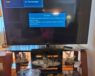 60" Samsung 1080 #UN60EH6003 LED TV w/remote and manual, glass/wood stand; J. Byron music boxes, ceramic planter with artificial orchid with glass flowers and collectible bookends